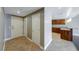 View of the entryway leading to the kitchen with granite countertops and wood cabinets at 150 Las Vegas Blvd # 2016, North Las Vegas, NV 89101