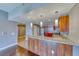 Open kitchen with granite countertops, stainless steel appliances, and bar seating area at 150 Las Vegas Blvd # 2016, North Las Vegas, NV 89101