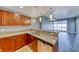 Kitchen with granite counters, stainless dishwasher, and an open floorplan to a room with a city view at 150 Las Vegas Blvd # 2016, North Las Vegas, NV 89101