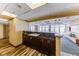 Sleek kitchenette area with dark wood cabinets, sink, and access to a lounge with city views at 150 Las Vegas Blvd # 2016, North Las Vegas, NV 89101