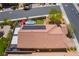 A bird's-eye view of a home with a backyard featuring a pool, patio area and solar panels on the roof at 184 Cullerton St, Las Vegas, NV 89148
