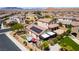 Expansive aerial showing a home with a backyard patio, outdoor kitchen, solar panels, and artificial grass at 184 Cullerton St, Las Vegas, NV 89148