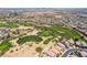 A picturesque aerial view of a golf course surrounded by homes in a residential neighborhood at 184 Cullerton St, Las Vegas, NV 89148