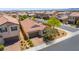 Stunning aerial perspective of a home with a private pool, solar panels, and a brick driveway at 184 Cullerton St, Las Vegas, NV 89148