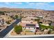 Gorgeous aerial view featuring a home with a backyard, solar panels, a spa, and lush landscaping at 184 Cullerton St, Las Vegas, NV 89148