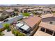 Bird's-eye view of home's backyard oasis featuring a pool, patio, barbecue area, solar panels, and manicured landscaping at 184 Cullerton St, Las Vegas, NV 89148