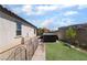 Backyard featuring artificial grass, swim spa, and secure pet fence at 184 Cullerton St, Las Vegas, NV 89148