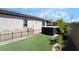 Well-maintained backyard with turf and swim spa at 184 Cullerton St, Las Vegas, NV 89148