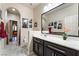 Well-lit bathroom featuring marble tile flooring, modern vanity, and decorated with unique black and white city skyline photographs at 184 Cullerton St, Las Vegas, NV 89148