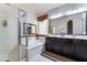 Bathroom featuring a double vanity, soaking tub, and glass enclosed shower at 184 Cullerton St, Las Vegas, NV 89148