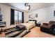 Comfortable bedroom with a modern ceiling fan, plush seating, and a stylish striped rug at 184 Cullerton St, Las Vegas, NV 89148