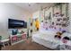 Fun bedroom featuring decorated walls, a daybed, and neutral color carpet at 184 Cullerton St, Las Vegas, NV 89148