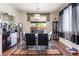 Bright dining room features modern décor and a sliding glass door with backyard access, creating an inviting space at 184 Cullerton St, Las Vegas, NV 89148