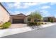 Lovely single-story home with a two-car garage, brick driveway, and well-maintained lawn at 184 Cullerton St, Las Vegas, NV 89148