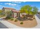 Inviting home showcasing a stucco exterior, covered porch, and low-maintenance desert landscaping at 184 Cullerton St, Las Vegas, NV 89148