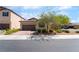 Single-story home featuring a brick driveway, well-maintained landscaping, and an attached two-car garage at 184 Cullerton St, Las Vegas, NV 89148