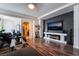 Bright living room featuring hardwood floors, a modern fireplace, and stylish furnishings offer a cozy atmosphere at 184 Cullerton St, Las Vegas, NV 89148