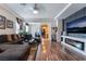 Spacious living room with hardwood floors, a modern fireplace, and stylish furnishings offer a cozy atmosphere at 184 Cullerton St, Las Vegas, NV 89148