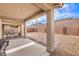 Backyard features a covered patio, gravel landscaping, and outdoor kitchen area at 2114 Thelen Ave, North Las Vegas, NV 89086