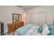 Comfortable bedroom with a large closet and a dresser with a large mirror at 2114 Thelen Ave, North Las Vegas, NV 89086