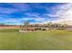 Scenic community dog park with lush green space and bench at 2114 Thelen Ave, North Las Vegas, NV 89086