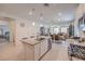 Open floor plan with a modern kitchen, dining area, and living room with tons of natural light at 2114 Thelen Ave, North Las Vegas, NV 89086