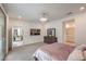 Spacious main bedroom featuring an entertainment center, slider to back yard, and an attached bath at 2114 Thelen Ave, North Las Vegas, NV 89086