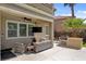 Outdoor living area with built in grill, ceiling fan, and outdoor TV at 2117 Mountain Rail Dr, North Las Vegas, NV 89084