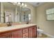 Bathroom with double vanity sinks, tile floors and views into another room at 2117 Mountain Rail Dr, North Las Vegas, NV 89084