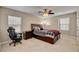Bedroom with a ceiling fan and a bed with storage drawers underneath at 2117 Mountain Rail Dr, North Las Vegas, NV 89084