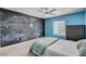 Bright bedroom features a chalkboard wall and a modern ceiling fan at 2117 Mountain Rail Dr, North Las Vegas, NV 89084