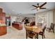 Dining area with wood table and chairs adjacent to the open kitchen at 2117 Mountain Rail Dr, North Las Vegas, NV 89084