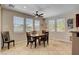 Dining area features a ceiling fan and natural light at 2117 Mountain Rail Dr, North Las Vegas, NV 89084