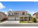 Charming two-story home featuring a two-car garage, landscaped front yard, and inviting curb appeal at 2117 Mountain Rail Dr, North Las Vegas, NV 89084