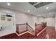 Second floor hallway with wood floors and access to the bedrooms at 2117 Mountain Rail Dr, North Las Vegas, NV 89084