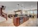 Kitchen island features a sink with an open floor plan to the living and dining areas at 2117 Mountain Rail Dr, North Las Vegas, NV 89084