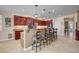 Elegant kitchen featuring a breakfast bar, hardwood floors, recessed lights, and ample counter space at 2117 Mountain Rail Dr, North Las Vegas, NV 89084