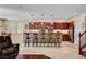 Stylish kitchen featuring a breakfast bar, hardwood floors, and pendant lighting, perfect for casual dining at 2117 Mountain Rail Dr, North Las Vegas, NV 89084