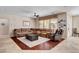 Comfortable living room with a plush sectional sofa, ceiling fan, neutral tones, and natural light at 2117 Mountain Rail Dr, North Las Vegas, NV 89084