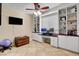 Home office with built-in shelves and a spacious work area at 2117 Mountain Rail Dr, North Las Vegas, NV 89084