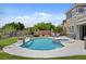 Inviting pool area with a hot tub, lounge chairs, and spacious backyard at 2117 Mountain Rail Dr, North Las Vegas, NV 89084