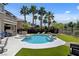 A backyard oasis offers a private pool, spa, and outdoor kitchen at 2117 Mountain Rail Dr, North Las Vegas, NV 89084