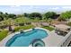 Aerial view of sparkling pool and lush landscaping at 2117 Mountain Rail Dr, North Las Vegas, NV 89084