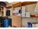 Walk-in closet with wood shelving, drawers, and organization space filled with clothes and luggage at 2117 Mountain Rail Dr, North Las Vegas, NV 89084