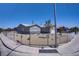 Exterior view of a home featuring a gravel yard and neutral paint at 2130 Revere St, North Las Vegas, NV 89030