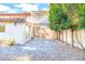 Home exterior shows a stone patio leading to a sunroom and second story pergola at 2204 Plaza De La Candela, Las Vegas, NV 89102