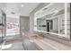 Contemporary bathroom with a large mirror, double vanity, and walk-in shower at 2204 Plaza De La Candela, Las Vegas, NV 89102