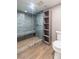 Luxurious bathroom with a glass-enclosed shower featuring green marble walls and a built-in shower bench at 2204 Plaza De La Candela, Las Vegas, NV 89102