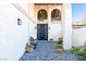 Front entrance with a stylish bench and a modern double-door entry at 2204 Plaza De La Candela, Las Vegas, NV 89102