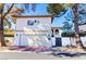 Two-story stucco home featuring a garage and private gated entrance at 2204 Plaza De La Candela, Las Vegas, NV 89102